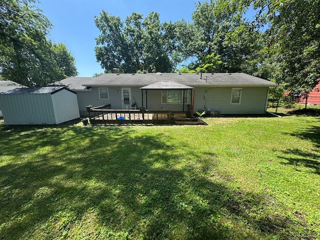 202 W Laharpe St, Kirksville, MO 63501 - rear view of property with a shed, a gazebo, a yard, and a wooden deck