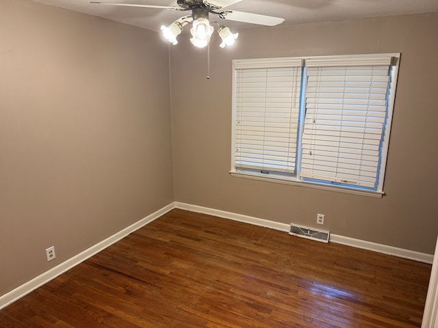 202 W Laharpe St, Kirksville, MO 63501 - spare room featuring ceiling fan and dark wood-style flooring