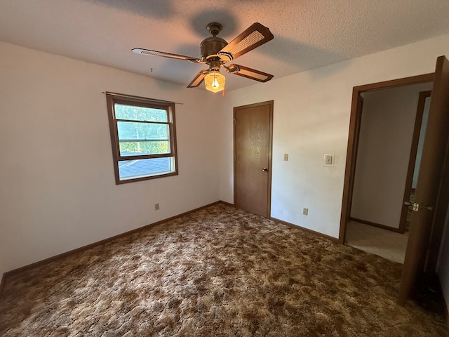 1214 E Washington, Kirksville, MO 63501 - unfurnished bedroom with carpet flooring, a ceiling fan, and a textured ceiling