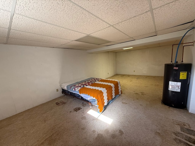 1214 E Washington, Kirksville, MO 63501 - bedroom featuring electric water heater, a drop ceiling, and carpet