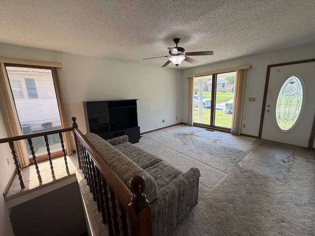 1214 E Washington, Kirksville, MO 63501 - living area featuring carpet, ceiling fan, and a textured ceiling