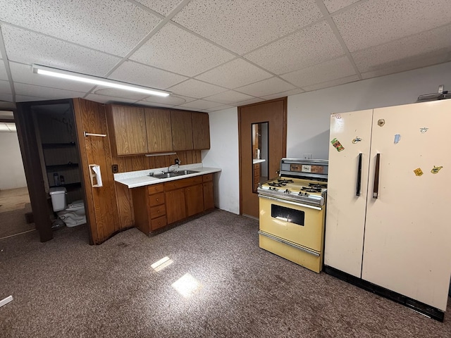 1214 E Washington, Kirksville, MO 63501 - kitchen with white appliances, brown cabinets, a paneled ceiling, and light countertops