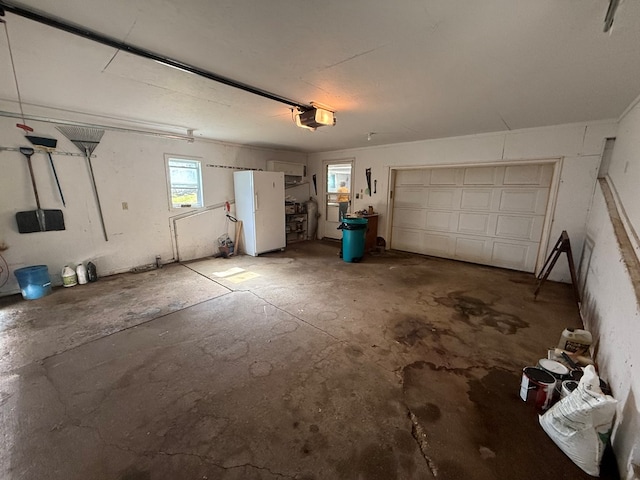 1214 E Washington, Kirksville, MO 63501 - garage featuring freestanding refrigerator and a garage door opener