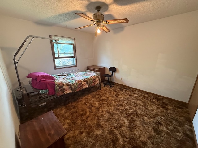 1214 E Washington, Kirksville, MO 63501 - carpeted bedroom with a textured ceiling and a ceiling fan