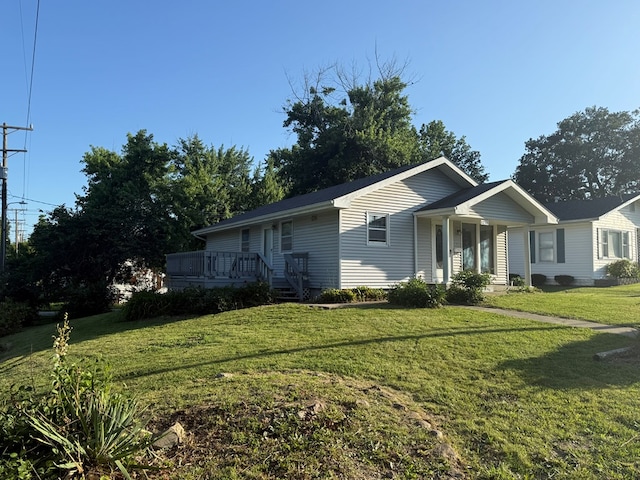 1214 E Washington, Kirksville, MO 63501 - ranch-style house with a front yard and a deck
