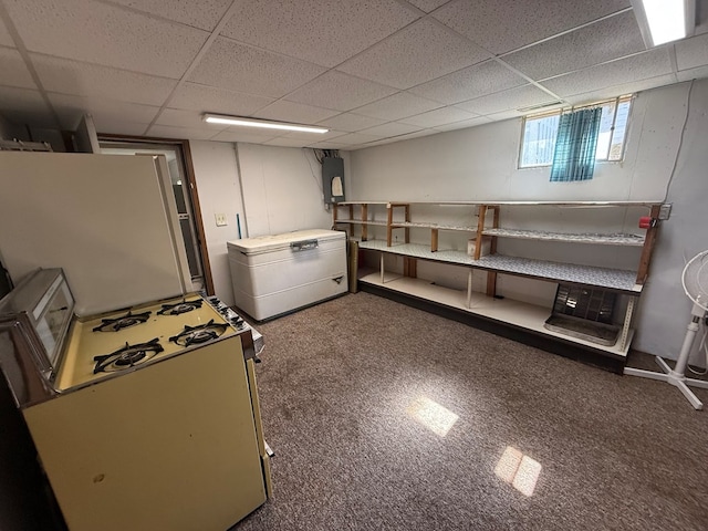 1214 E Washington, Kirksville, MO 63501 - below grade area with refrigerator, a drop ceiling, carpet floors, water heater, and freestanding refrigerator