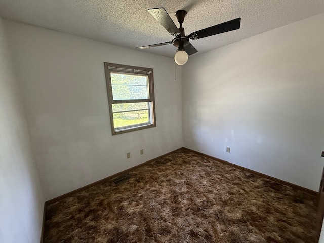1214 E Washington, Kirksville, MO 63501 - spare room with a ceiling fan, carpet, and a textured ceiling