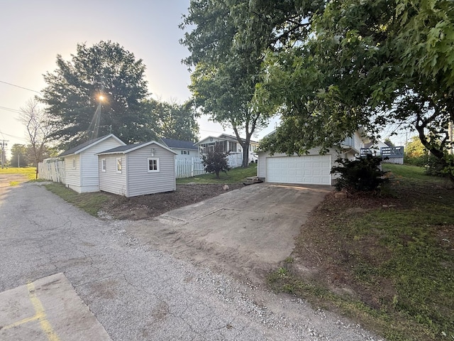 1214 E Washington, Kirksville, MO 63501 - view of property exterior with an outbuilding, driveway, and a garage