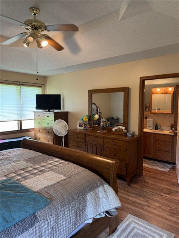 34829 State Highway C, Bevier, MO 63532 - bedroom with wood finished floors, connected bathroom, and ceiling fan