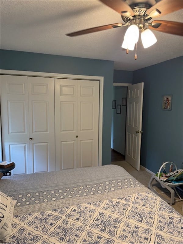 34829 State Highway C, Bevier, MO 63532 - bedroom with a closet, carpet floors, and ceiling fan