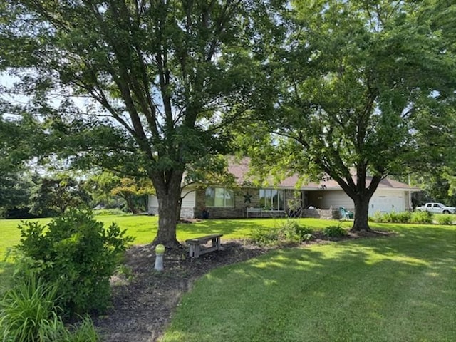 34829 State Highway C, Bevier, MO 63532 - view of grassy yard featuring an attached garage