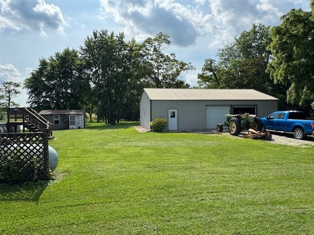 34829 State Highway C, Bevier, MO 63532 - view of grassy yard with a detached garage and an outdoor structure