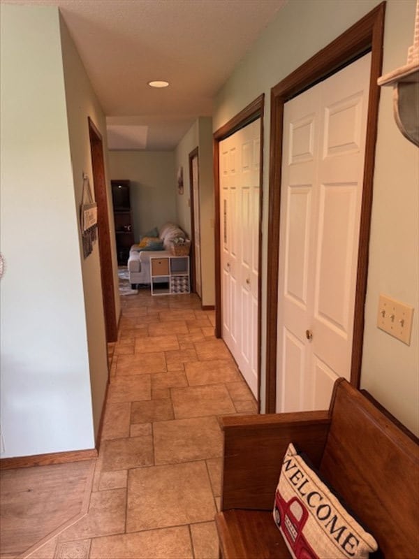 34829 State Highway C, Bevier, MO 63532 - corridor featuring light stone finish floors and baseboards