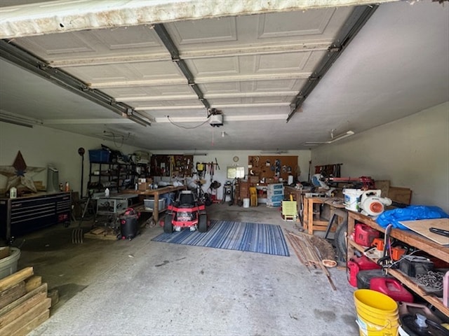 34829 State Highway C, Bevier, MO 63532 - garage with a workshop area and a garage door opener
