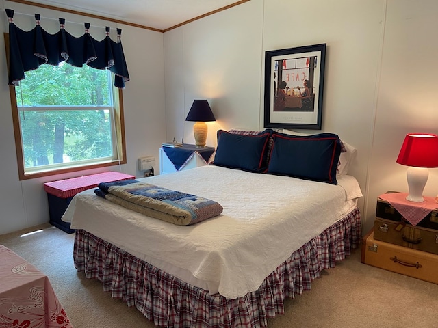 bedroom with crown molding and carpet flooring