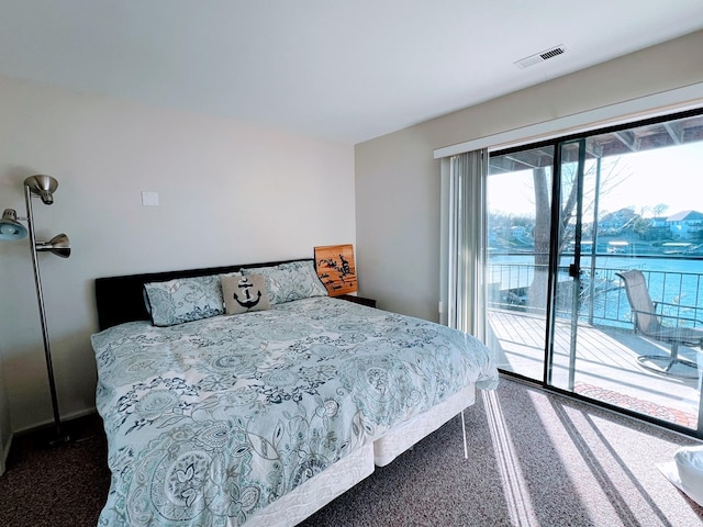 carpeted bedroom featuring access to outside