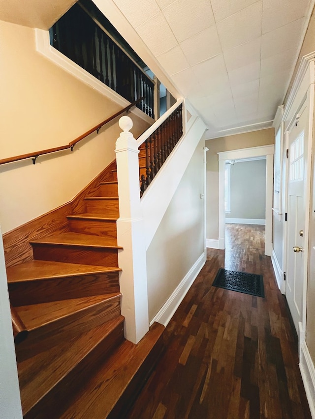 stairway featuring hardwood / wood-style flooring