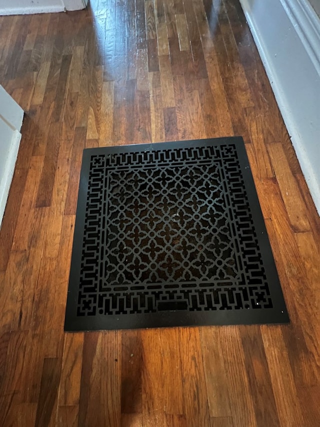 interior details featuring hardwood / wood-style flooring