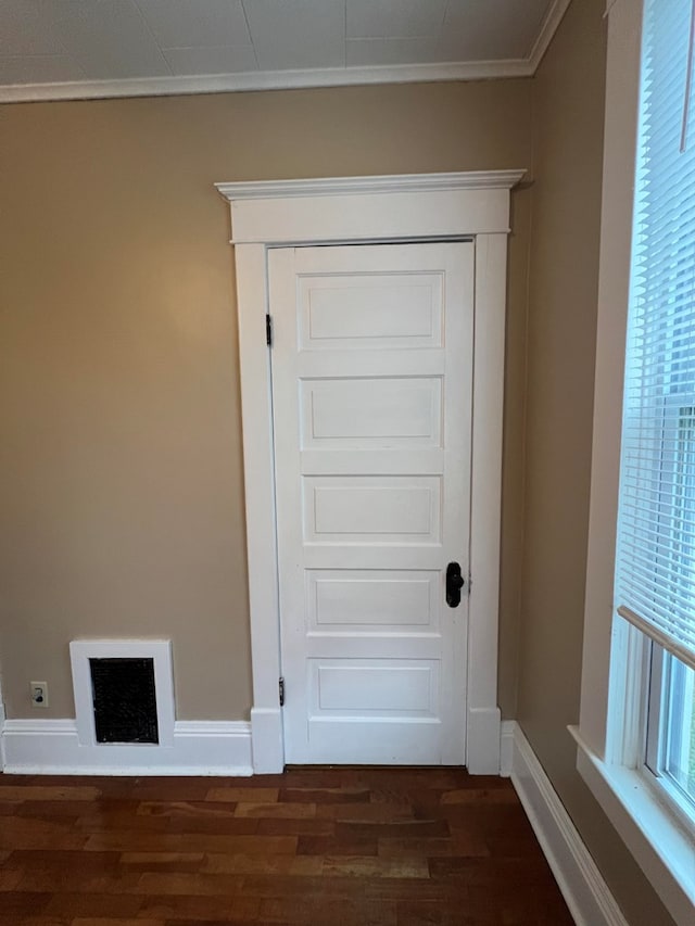 room details with hardwood / wood-style floors and ornamental molding