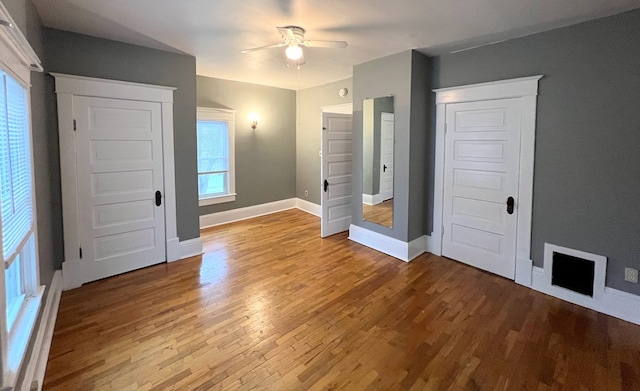 unfurnished bedroom featuring ceiling fan and wood-type flooring