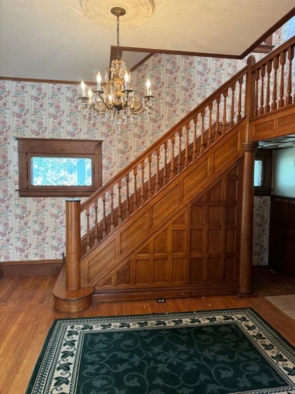 stairway featuring wood-type flooring