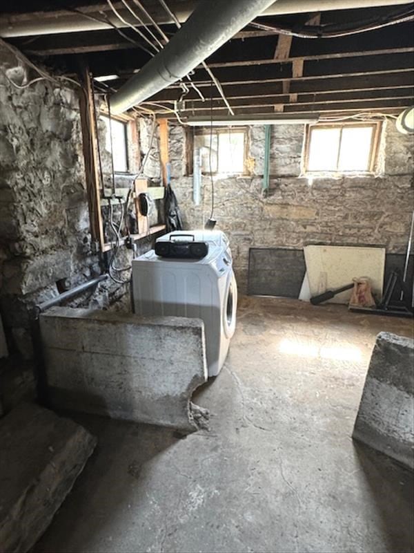 basement with washer and clothes dryer