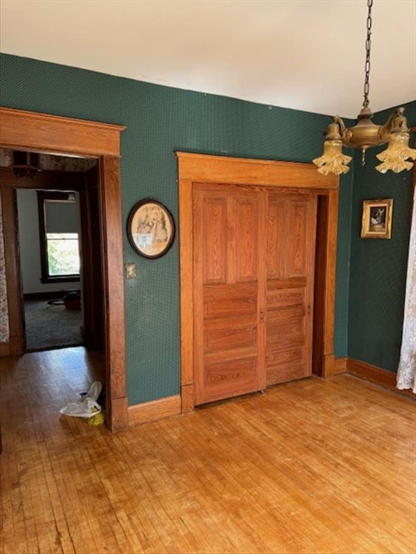 unfurnished bedroom with wood-type flooring