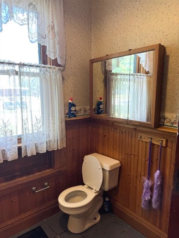 bathroom with tile patterned floors and toilet