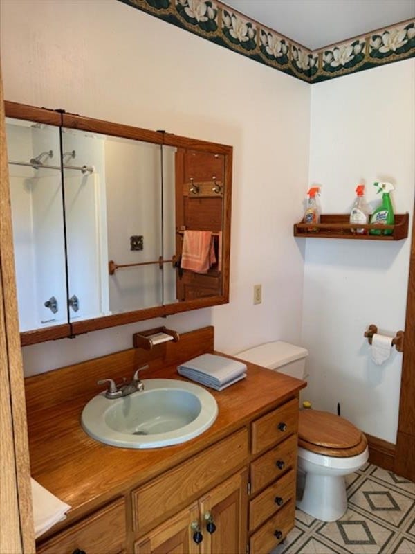 bathroom with vanity and toilet