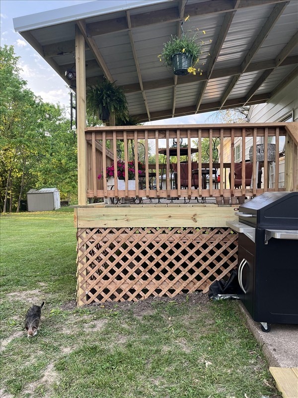 201 N Wentz, Macon, MO 63552 - wooden deck featuring a yard, a storage shed, and a grill