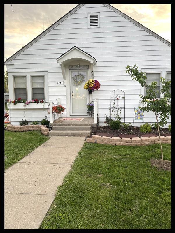 201 N Wentz, Macon, MO 63552 - view of exterior entry with a lawn