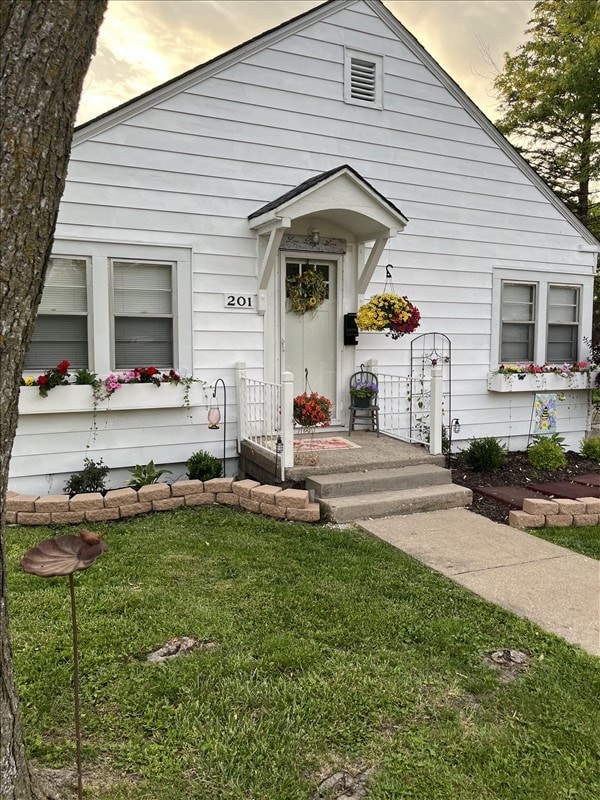 201 N Wentz, Macon, MO 63552 - view of exterior entry with a lawn