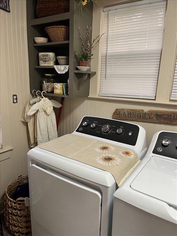 201 N Wentz, Macon, MO 63552 - laundry area with separate washer and dryer, wood walls, and built in features