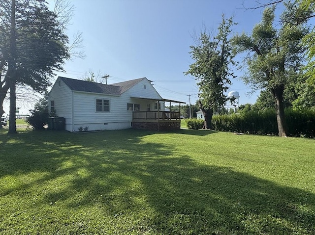 201 N Wentz, Macon, MO 63552 - view of grassy yard featuring a wooden deck