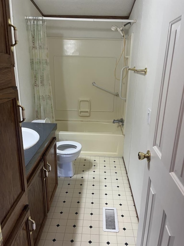 bathroom with visible vents, vanity, toilet, and shower / tub combo with curtain