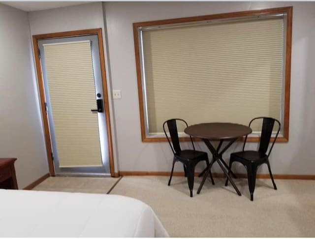 101 S Main St, Usa, Marceline, MO 64658 - dining area with baseboards and light carpet