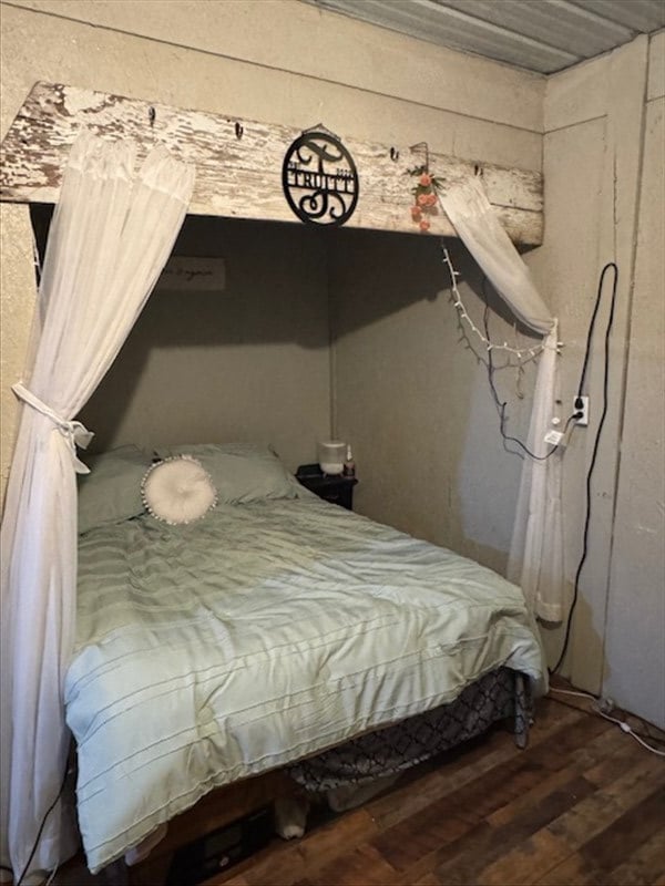 bedroom with wood finished floors