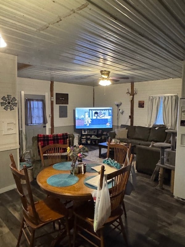 dining area featuring wood finished floors and a ceiling fan