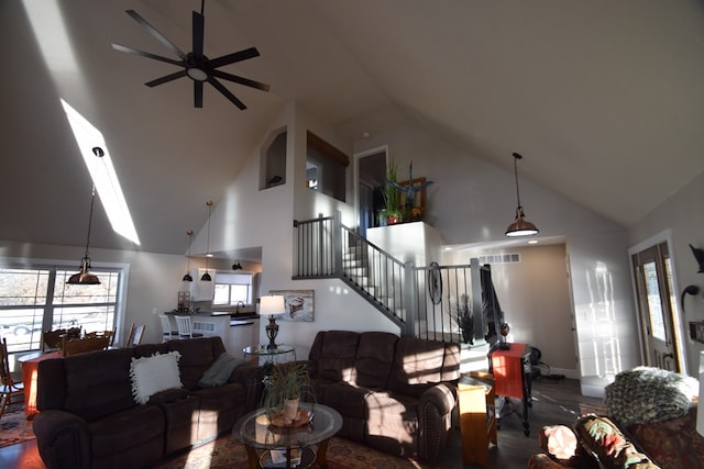 living room featuring high vaulted ceiling and ceiling fan