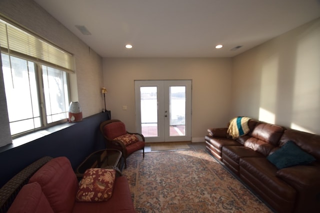 living room with plenty of natural light and french doors