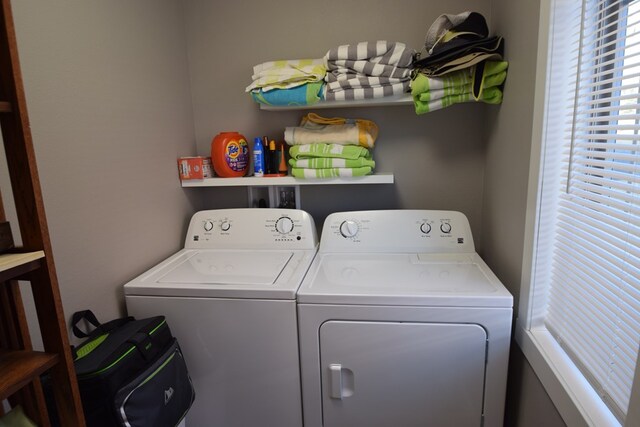 washroom featuring washing machine and dryer