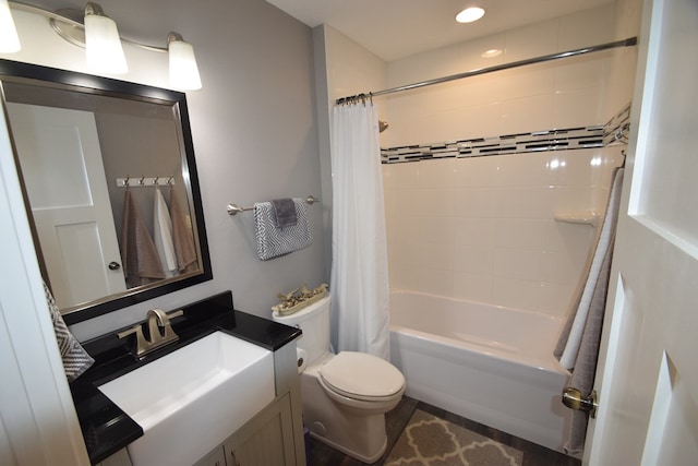 full bathroom with toilet, vanity, and shower / bath combination with curtain