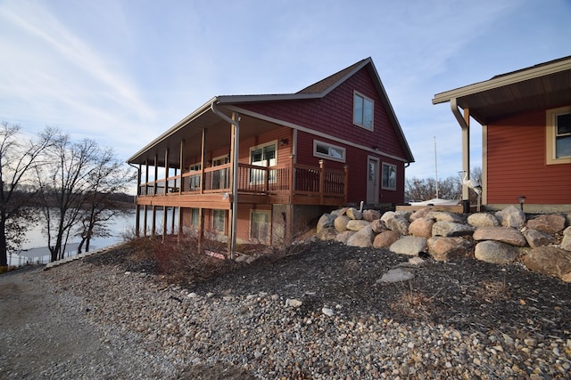 view of side of home with a wooden deck