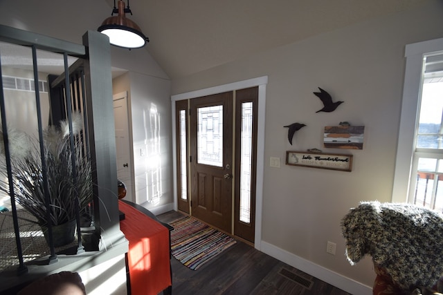 foyer with lofted ceiling and dark hardwood / wood-style floors