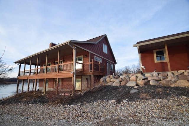 view of home's exterior with a wooden deck