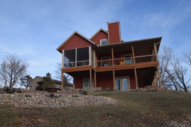 rear view of house with a sunroom