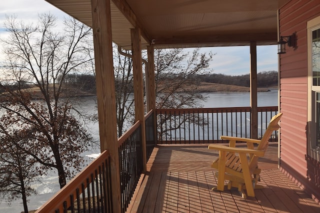 wooden terrace with a water view