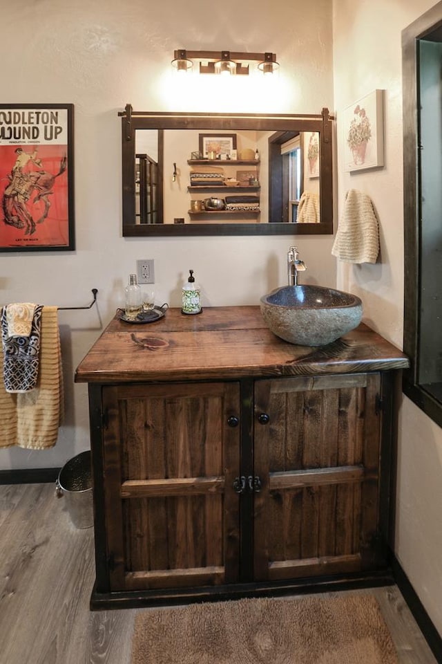 bathroom featuring vanity and hardwood / wood-style flooring