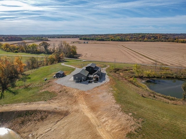 aerial view with a rural view and a water view