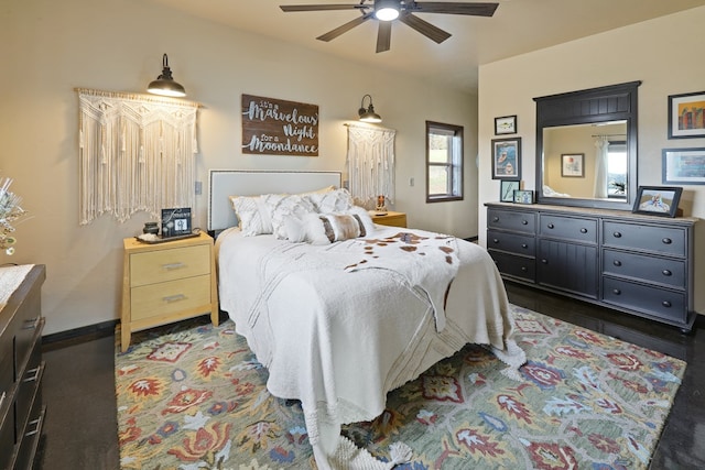 bedroom featuring ceiling fan and dark hardwood / wood-style floors